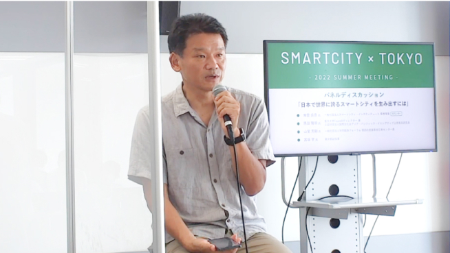 写真:パネルディスカッションで話している宮坂学